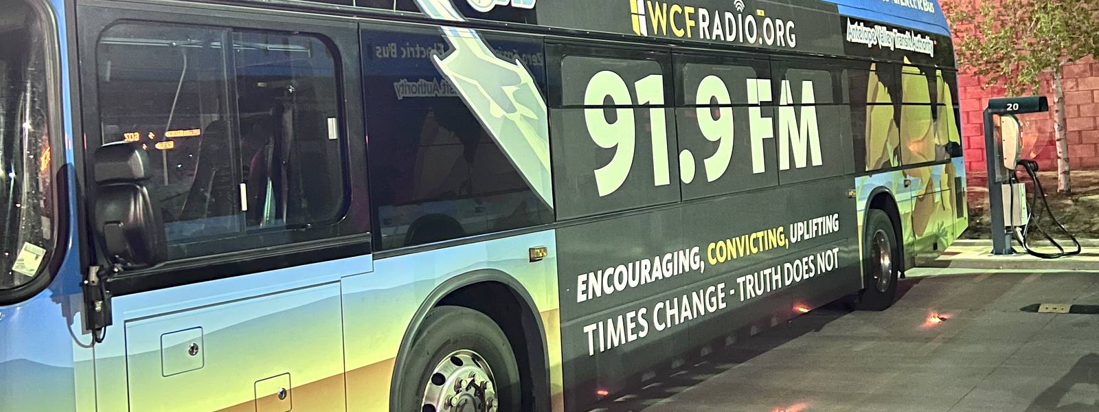All-electric transit bus with ad wrap